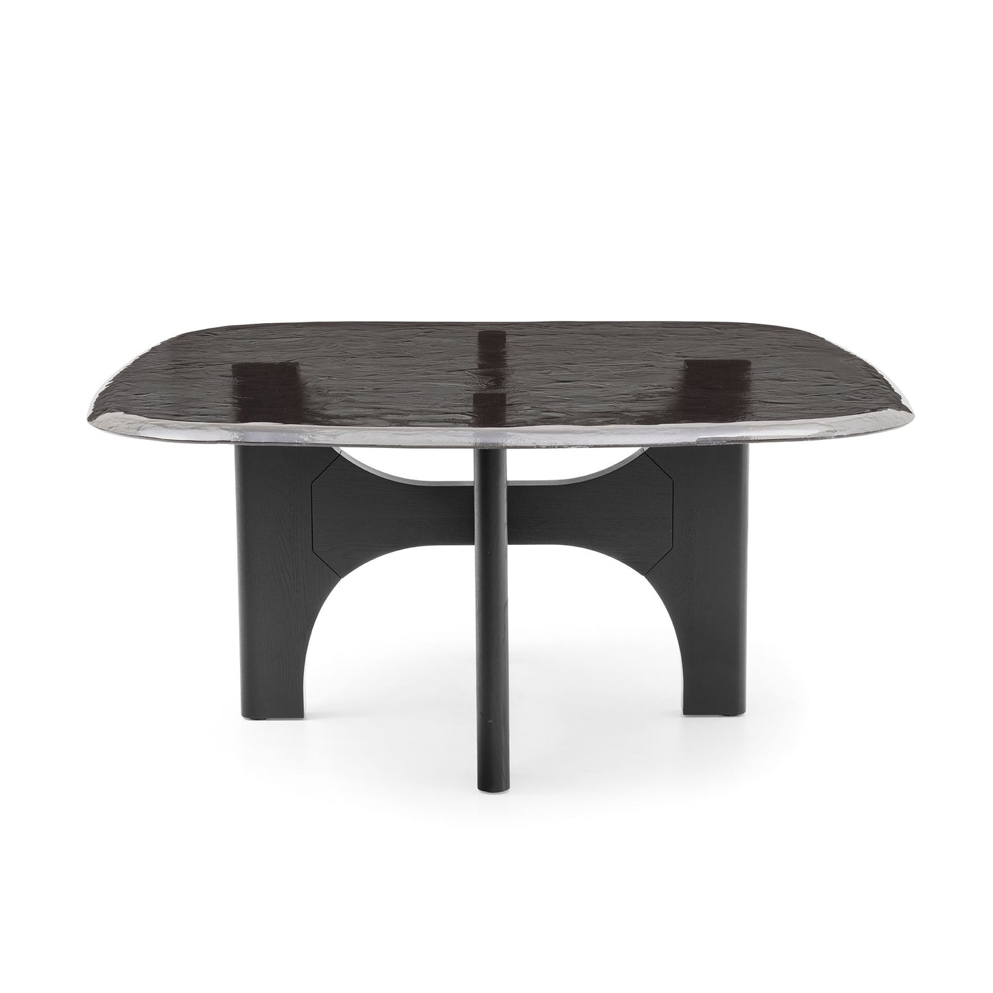 A modern black dining table with a rounded rectangular top, a central pedestal base, and a polished silver metallic rim, shown on a white background.